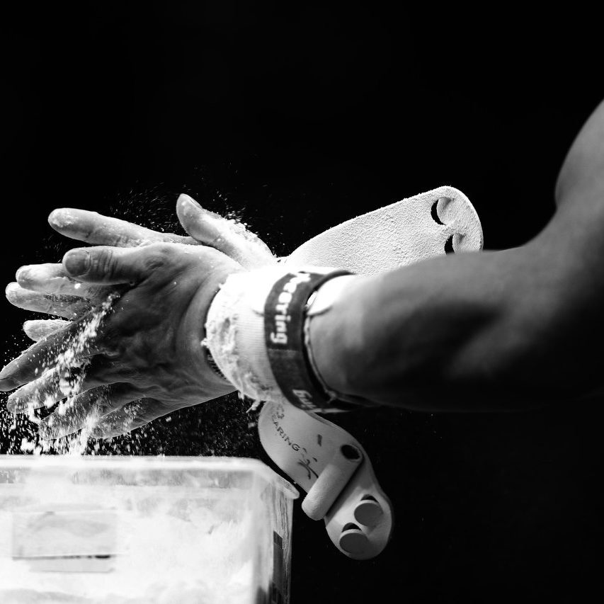 Olympics - Athletics - CHN Weiyang Guo of China puts chalk on his hands before he performs on the Horse in the Gymnastics Artistic at the North Greenwich Arena